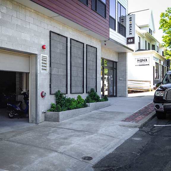 a motorcycle is parked in the garage of a building.